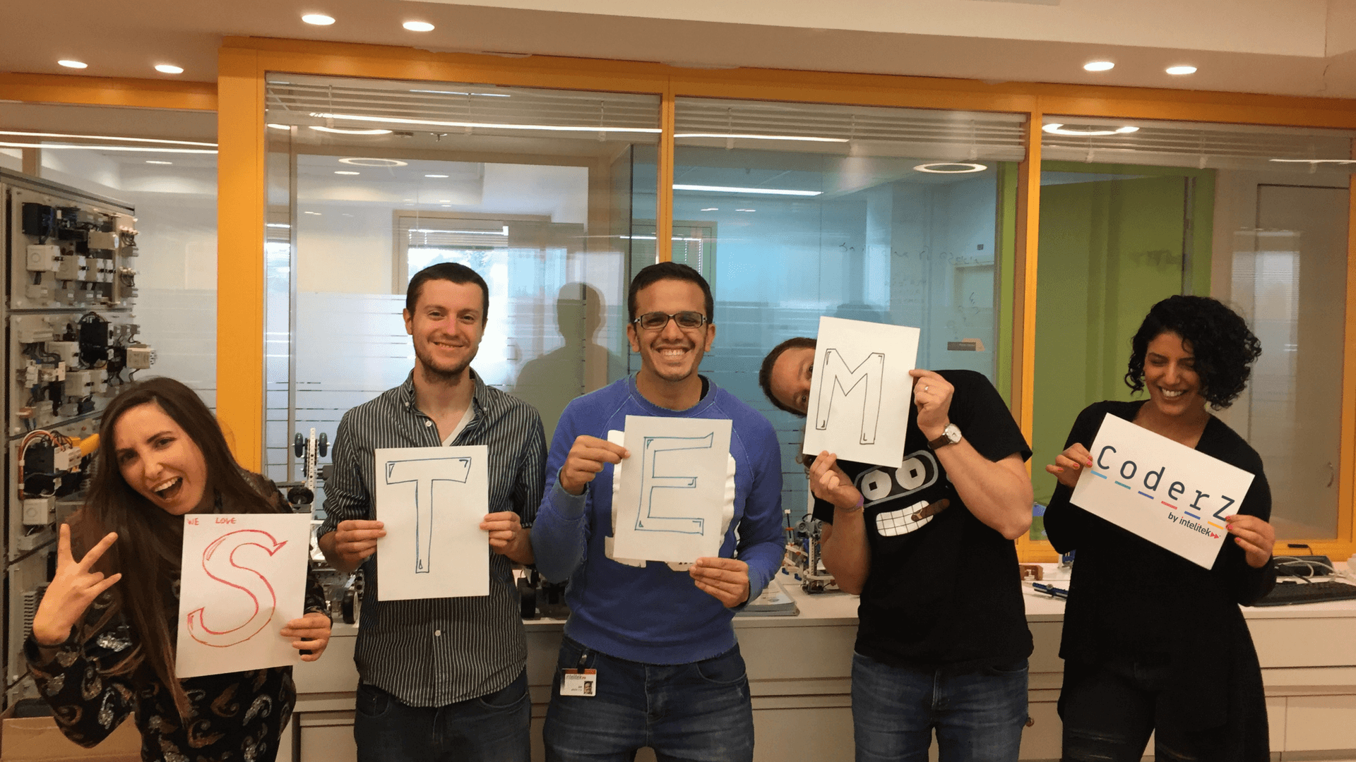 CoderZ team with STEM signs